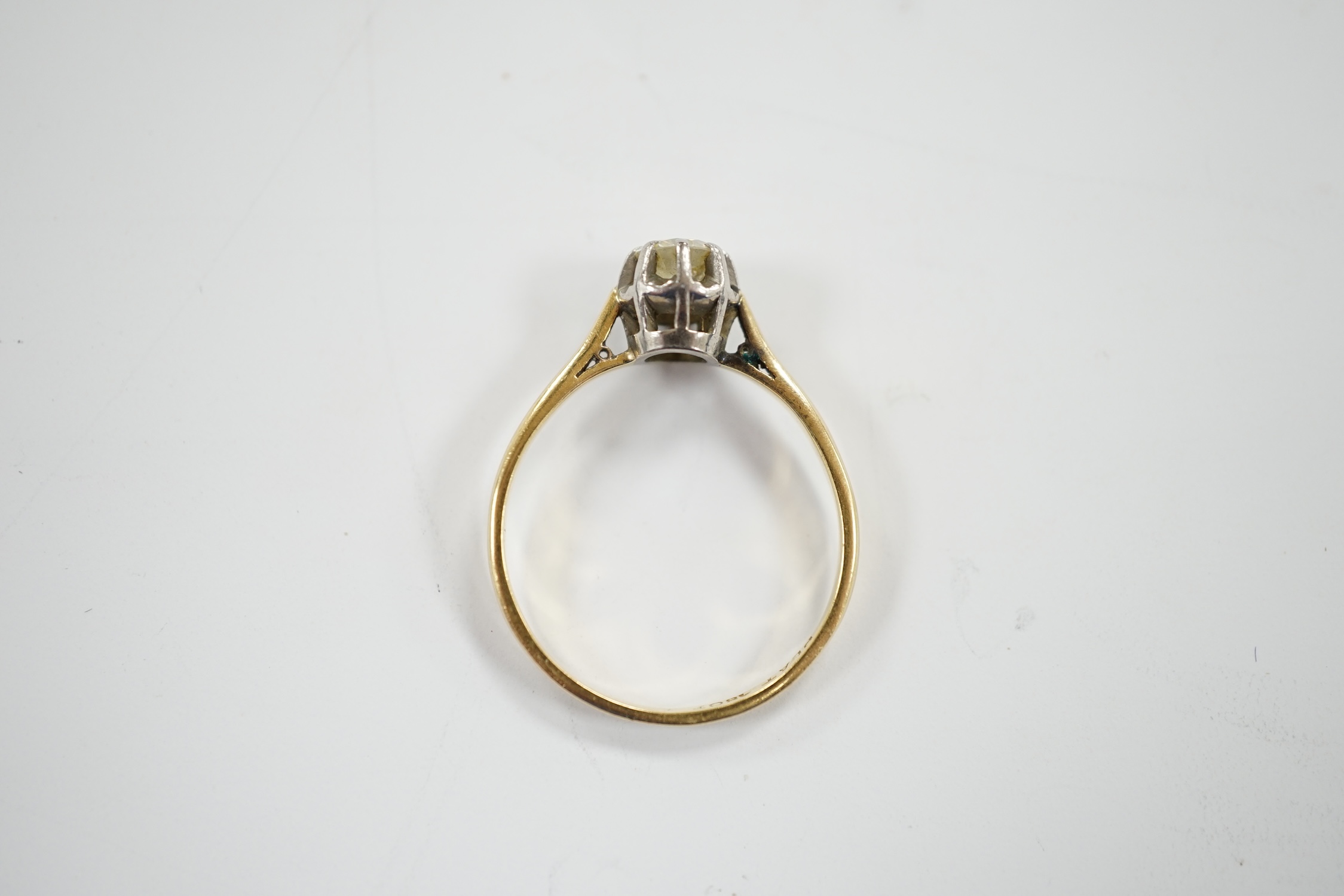 An early 20th century 18ct, plat and claw set solitaire diamond ring, size S, gross weight 2.8 grams.